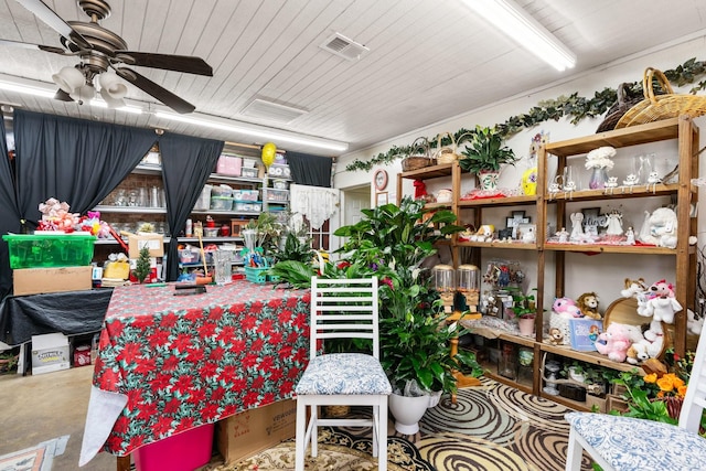 interior space with ceiling fan and concrete flooring