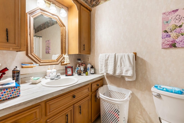 bathroom with vanity and toilet