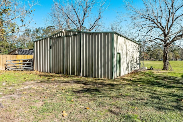 view of outbuilding featuring a yard