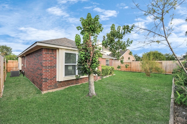 view of yard with central AC