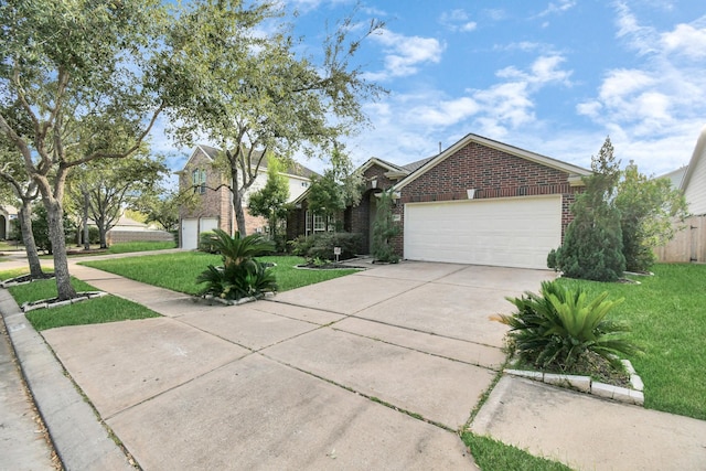 view of front of property featuring a garage and a front lawn