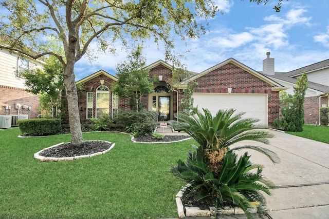 view of front of house featuring a front yard and a garage