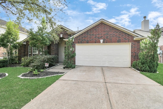 view of front of home with a front yard and a garage