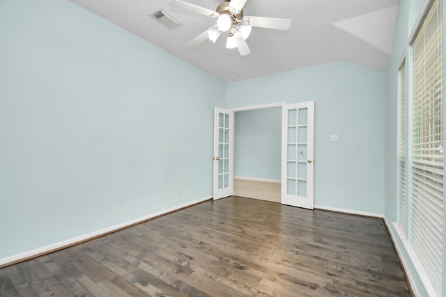 unfurnished bedroom featuring french doors, vaulted ceiling, ceiling fan, and dark wood-type flooring