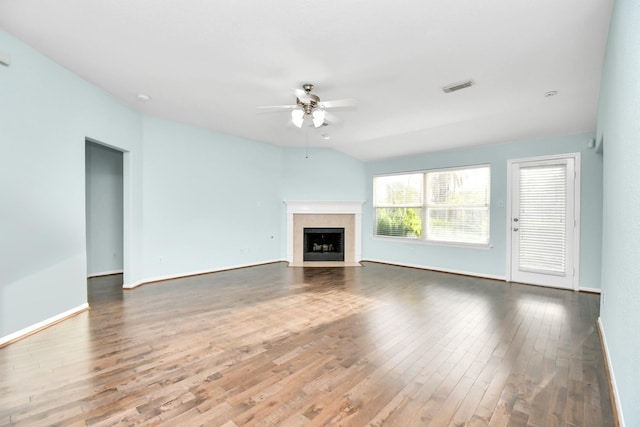 unfurnished living room with hardwood / wood-style floors, ceiling fan, and lofted ceiling