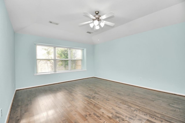 unfurnished room featuring ceiling fan, wood-type flooring, and lofted ceiling