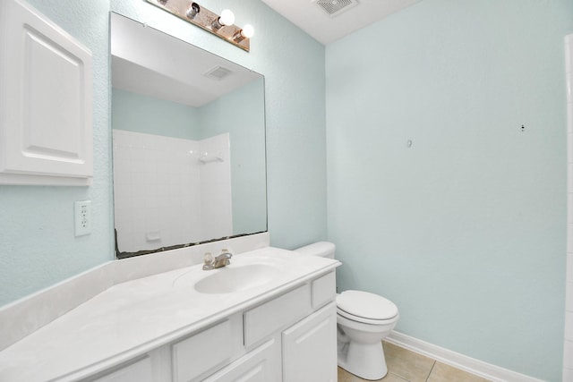 bathroom with tile patterned floors, a shower, vanity, and toilet