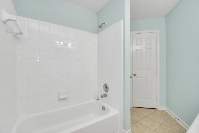 bathroom with tile patterned flooring and tiled shower / bath