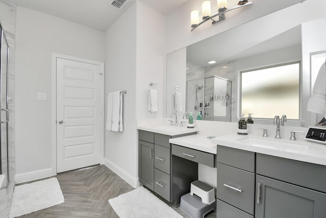 bathroom with vanity, parquet floors, and walk in shower