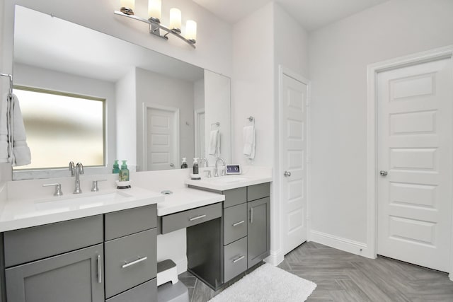 bathroom with vanity and parquet floors