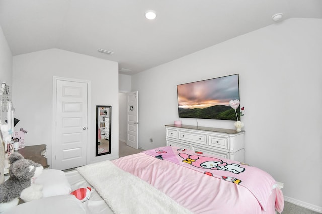 carpeted bedroom featuring lofted ceiling