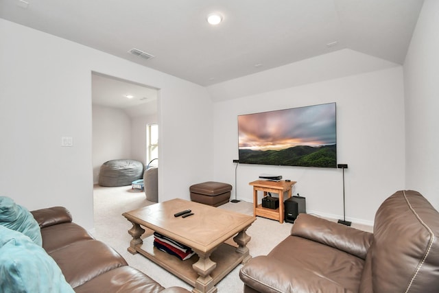 carpeted living room with vaulted ceiling