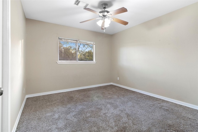 spare room featuring carpet and ceiling fan