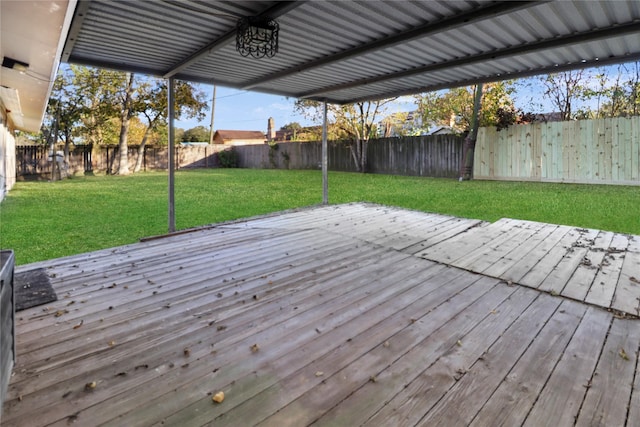 wooden terrace featuring a yard