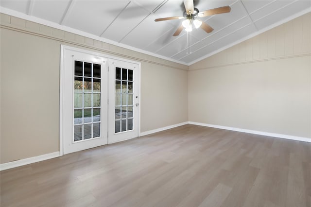 unfurnished room with ceiling fan, wood-type flooring, and vaulted ceiling