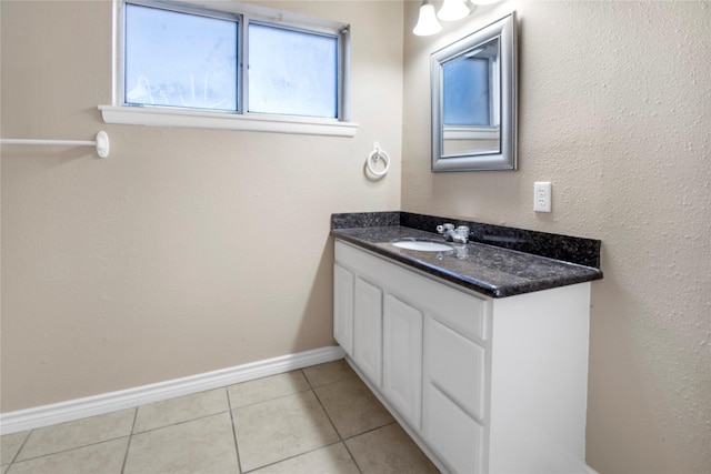 bathroom with tile patterned flooring and vanity