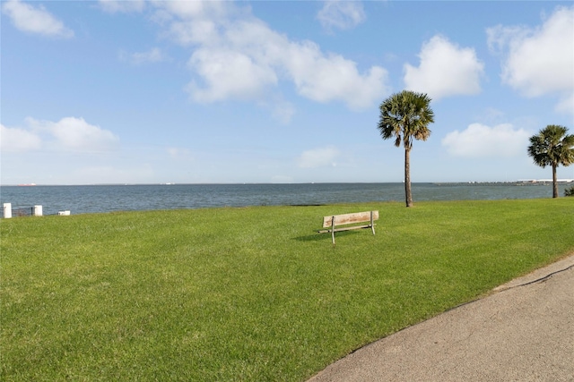 exterior space with a water view and a yard