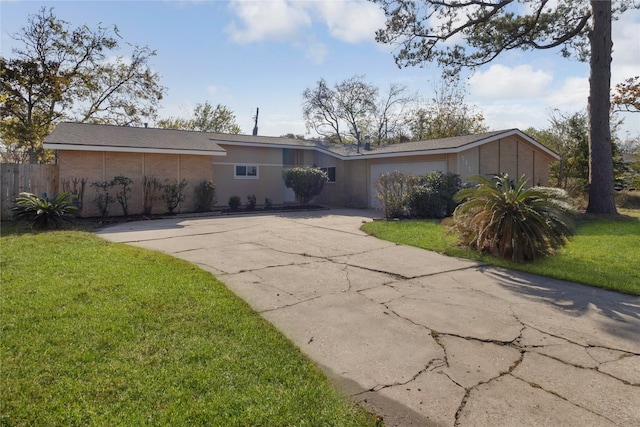 ranch-style home with a front lawn