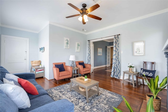 living room featuring ornamental molding, ceiling fan, and dark wood-type flooring