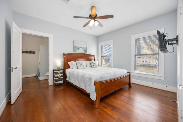 bedroom with ceiling fan and dark hardwood / wood-style flooring