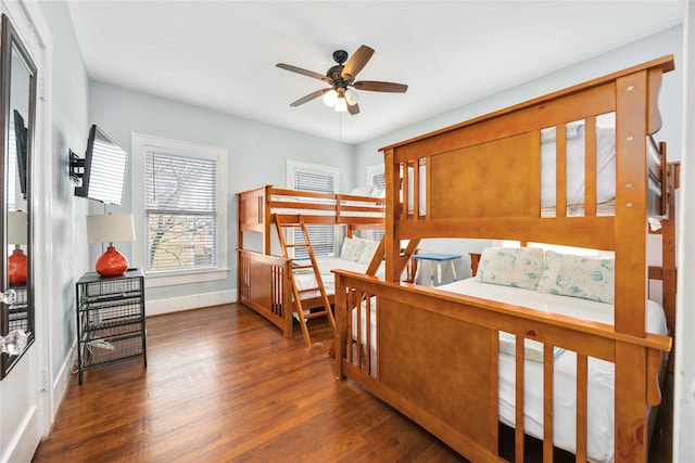 bedroom featuring dark hardwood / wood-style flooring and ceiling fan