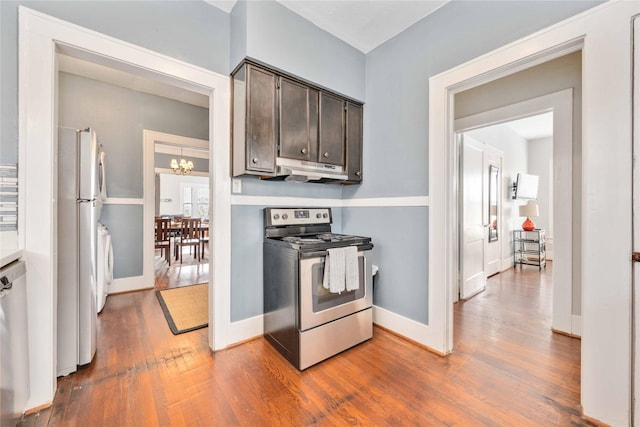 kitchen with hardwood / wood-style flooring, dark brown cabinets, and appliances with stainless steel finishes