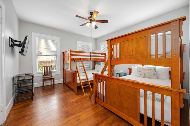 bedroom featuring ceiling fan and dark hardwood / wood-style flooring