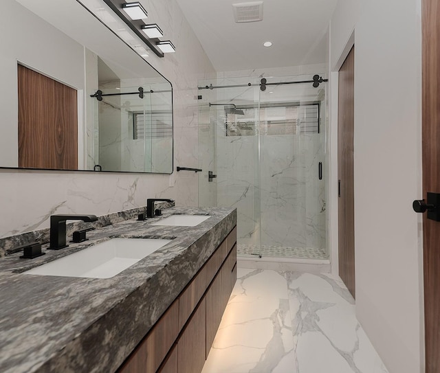 bathroom featuring vanity and an enclosed shower