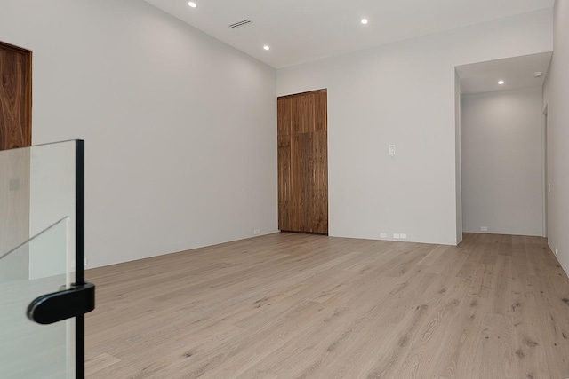 unfurnished room with light wood-type flooring