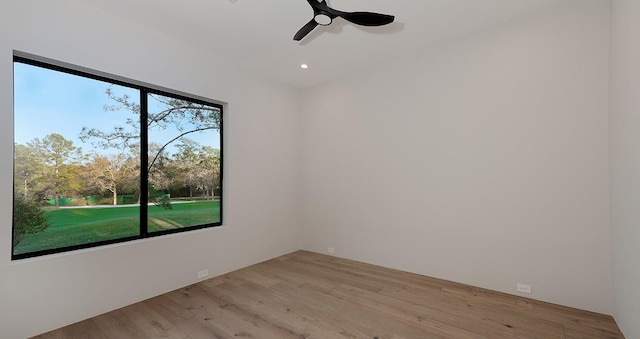 unfurnished room with ceiling fan and light wood-type flooring