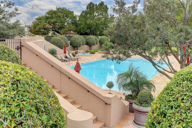 view of swimming pool with a patio area