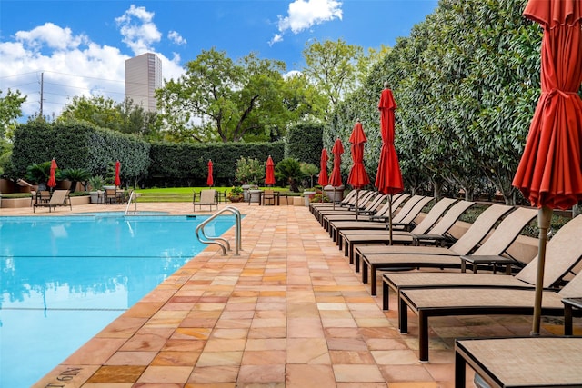 view of swimming pool featuring a patio