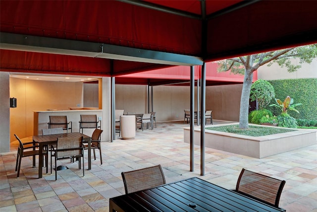 view of patio / terrace with a gazebo and an outdoor bar