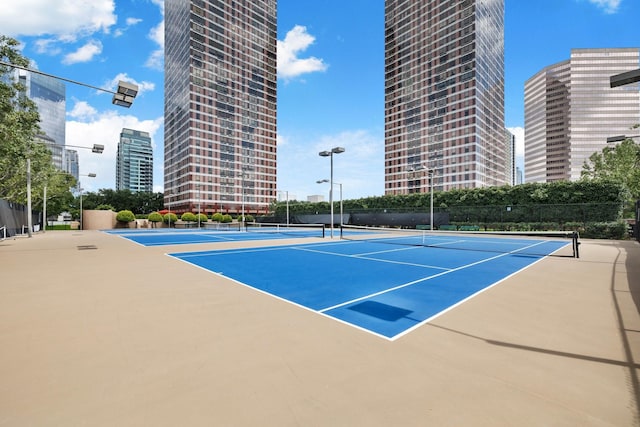 view of tennis court with basketball court