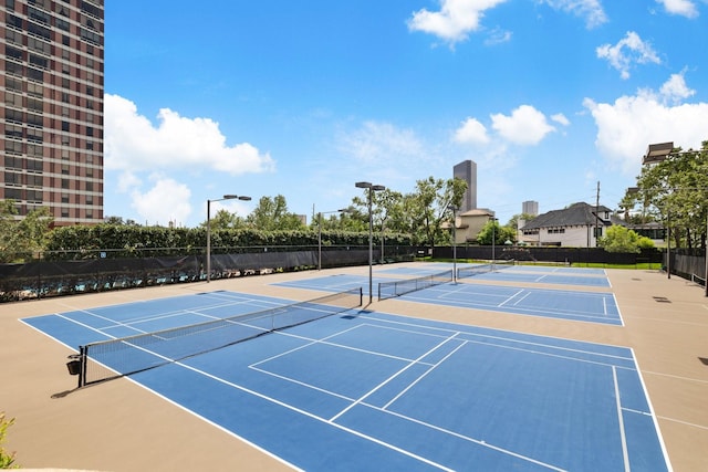 view of sport court featuring basketball hoop