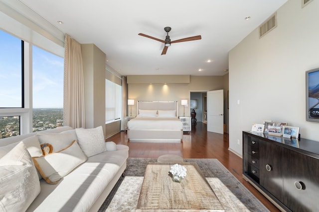 bedroom featuring ceiling fan and dark hardwood / wood-style flooring