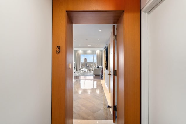 corridor featuring light tile patterned floors