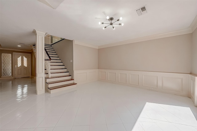 interior space featuring ornamental molding, a notable chandelier, and light tile patterned flooring