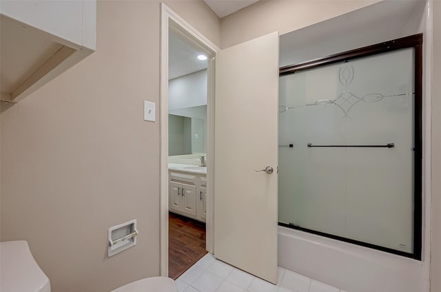 full bathroom with tile patterned floors, vanity, enclosed tub / shower combo, and toilet