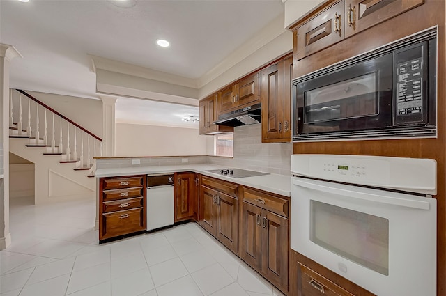 kitchen with black appliances, decorative backsplash, light tile patterned floors, and crown molding