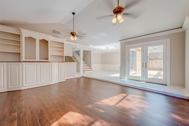 unfurnished living room featuring dark hardwood / wood-style floors, ceiling fan, french doors, and vaulted ceiling