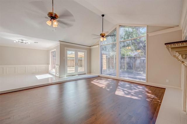 interior space featuring hardwood / wood-style floors, ceiling fan, ornamental molding, and vaulted ceiling