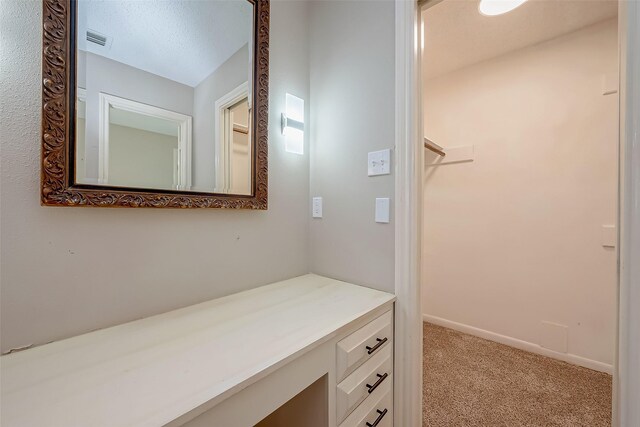 bathroom featuring a textured ceiling