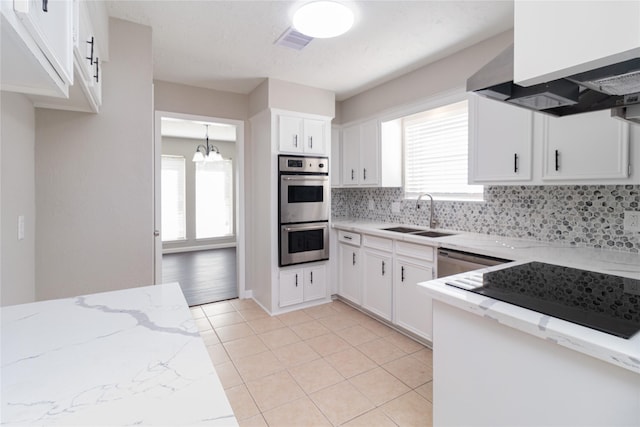 kitchen with white cabinets, stainless steel appliances, plenty of natural light, and sink