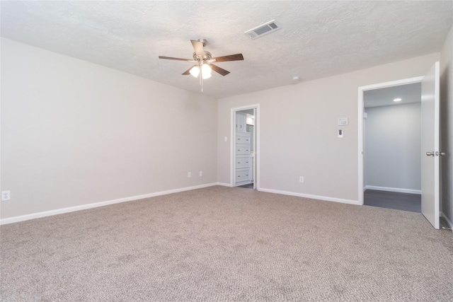 interior space with ceiling fan and a textured ceiling