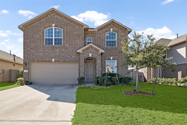 front facade featuring a front yard and a garage