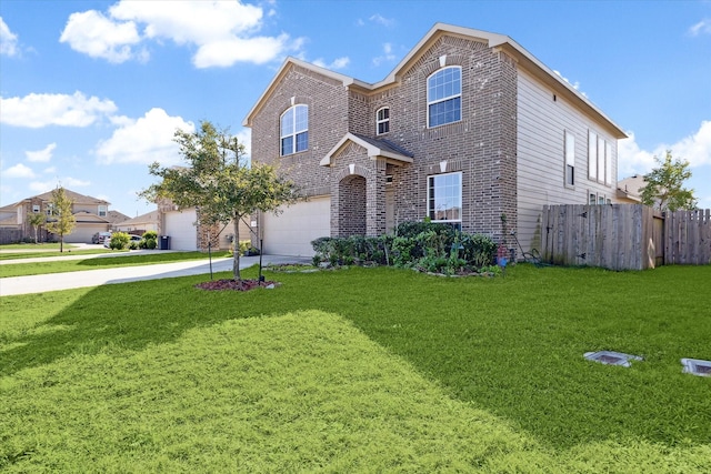 front of property with a front yard and a garage