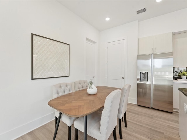 dining space featuring light hardwood / wood-style floors