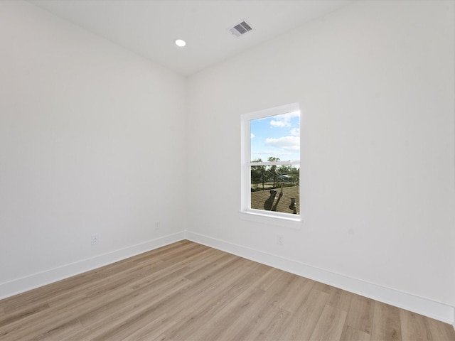 spare room featuring light hardwood / wood-style flooring