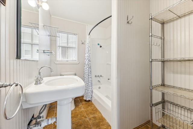 bathroom with crown molding, tile patterned floors, and shower / bath combo with shower curtain